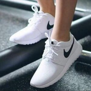 White with black accent Nike Roshe sneakers